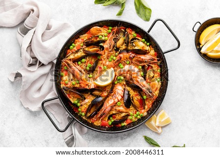 Spanish paella in a special pan, ready to eat, top down view culinary recipe concept Royalty-Free Stock Photo #2008446311