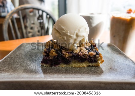 Blueberry Crumble on one scoops of vanilla ice cream