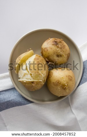 Hot boiled potatoes, base of many national cuisines Royalty-Free Stock Photo #2008457852