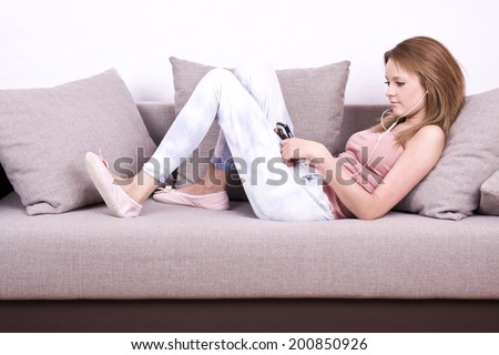 young girl relaxing and listening a music