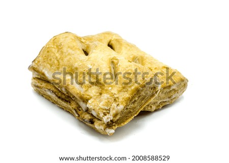 apple turnover with icing isolated on a white background