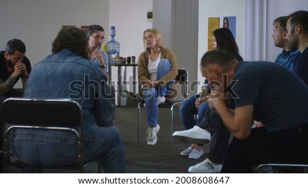 Woman speaking about traumatic event during psychotherapy session Royalty-Free Stock Photo #2008608647