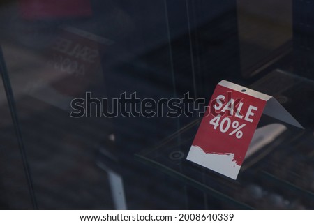 Sale sign at the window shop in the mall	