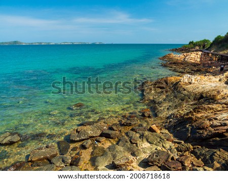 front view clear blue sea calm waves. wind blows cool And still, see rocks distance, still see island And sky clear, look relaxed. Suitable relax and travel"Khao Leam Ya National Park" Rayong Thailand