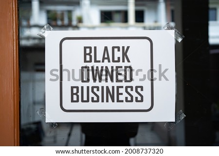 Black owned business sign on the window