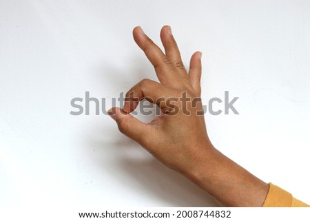 hand showing ok sign with white background