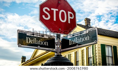 Street Sign the Direction Way to Inflation versus Deflation Royalty-Free Stock Photo #2008761980