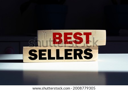 Best sellers sign on a wooden desk in a bright room 