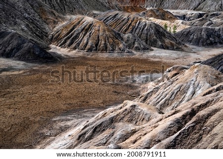 Landscape like a planet Mars surface. Ural refractory clay quarries. Nature of Ural mountains, Russia. The hardened red-brown surface of the earth.
For screensaver for desktop, banner, cover.
