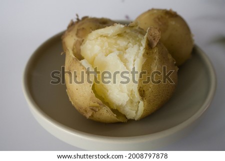 Hot boiled potatoes, base of many national cuisines Royalty-Free Stock Photo #2008797878