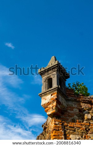 Details of ruins of a mysterious castle against the blue sky. Photo taken at noon, perfect lighting conditions