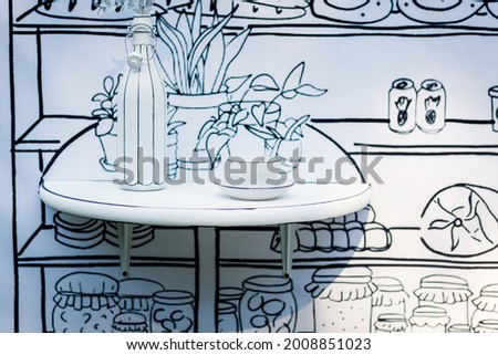old traditional French restaurant, a shop sign. water bottle and mug