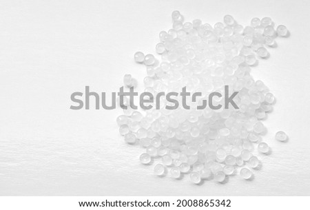 Close up picture of polypropylene granules, selective focus. Royalty-Free Stock Photo #2008865342
