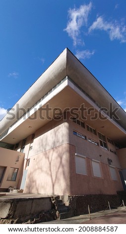 Fragment of the facade of a white modernist building. White building fragment. White facade of the building. Soviet modernism Royalty-Free Stock Photo #2008884587