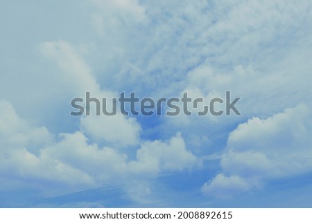 A fluffy white clounds on blue sky.