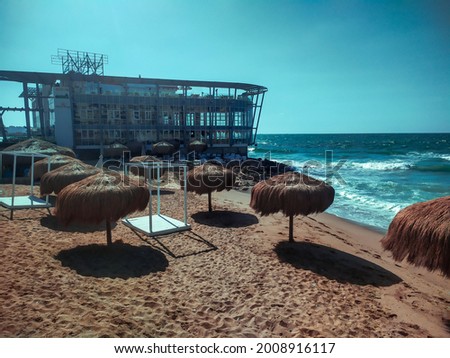 Casino On The Sea With Some Umbrellas