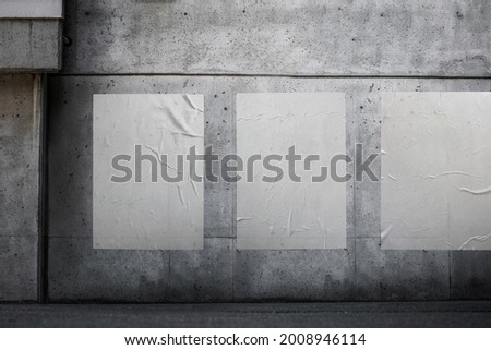 White paper poster mockup. Set of wet wrinkled and creased paper sheets with crumpled texture, blank posters glued to street wall or advertising column, mock up for design Royalty-Free Stock Photo #2008946114