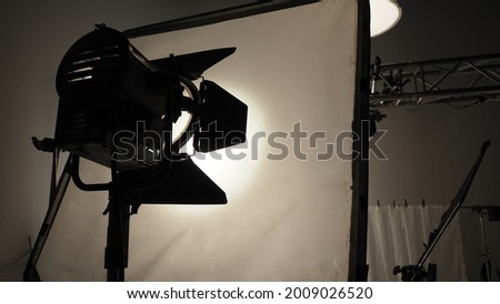Studio light equipments for photo or film movie video. Light set for professional shooting studio background. LED Flood light and Spot light for video production studio. Setup Barn door and softbox.