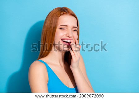 Photo portrait red haired woman wearing pretty singlet laughing overjoyed isolated pastel blue color background