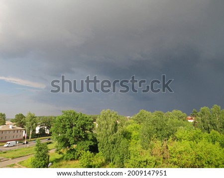 Storm, clouds gather, storm clouds before rain with hail, landscape with dark sky