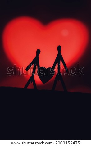 Concept of loving couples with matchsticks. Male and Female close together with beautiful heart shapes in the background. Matchstick art photography used matchsticks to create the character. Royalty-Free Stock Photo #2009152475