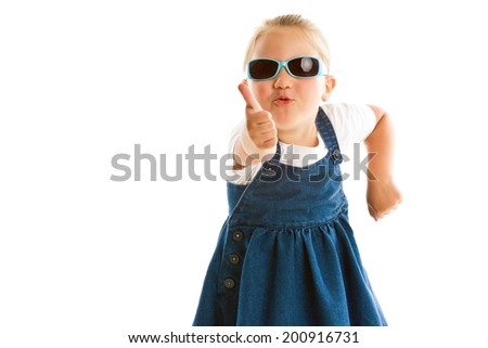 the little girl showing thumbs up