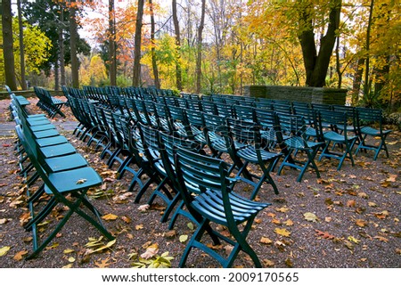 Wedding party with green colour outdoor chairs on the outdoor garden setting