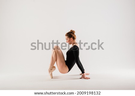 Young ballet female dancer isolated on white background