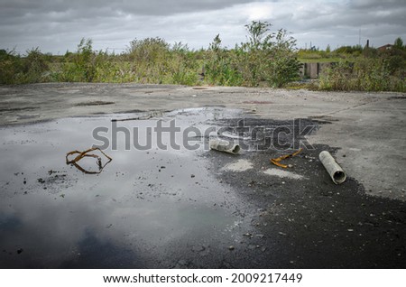 Brownfield land, site of former chemical factory manufacturing pesticides, recently demolished  Royalty-Free Stock Photo #2009217449
