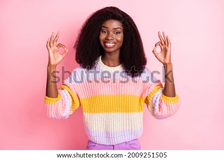 Photo of attractive dark skin girl two arms fingers show okey symbol good job isolated on pink color background