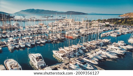 Bodrum Cruise Port southwestern Aegean sea harbor. A stunning view of sailing yachts in Port. Yachts in sunset bay. Sailing boats sunset scene. Sunset yachts view. Yachts in sunset bay.  Royalty-Free Stock Photo #2009356127