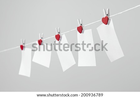 paper notes hanging on on the rope with clothespins