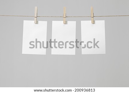 paper notes hanging on on the rope with clothespins
