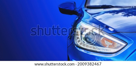 Car headlight. Lamp of modern car headlight. Close up view with copy space. Royalty-Free Stock Photo #2009382467