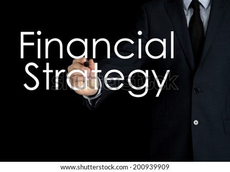 businessman writing financial strategy on black background