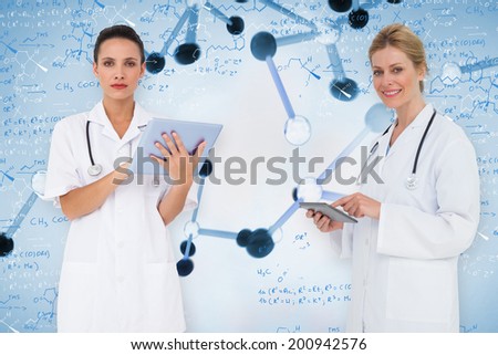 Composite image of female medical team against notes of biotechnology and genes