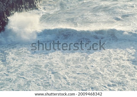 big waves breaking on rocks
