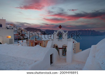 Evening sunset scenery at Santorini, Greece, Santorini is one of the Cyclades islands in the Aegean Sea, The whitewashed, cubiform houses of its 2 principal towns Royalty-Free Stock Photo #2009498891