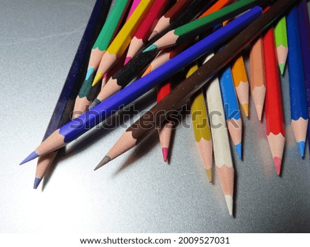 colored pencils lying on the table. close-up