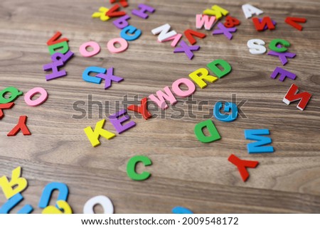 Selective focus on the Keyword lettering using colorful wooden alphabets.