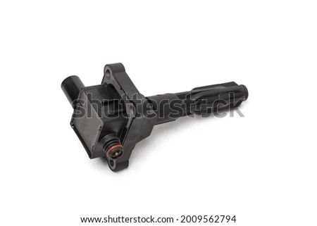 Ignition coil for an internal combustion engine of a car during repair and service on a white isolated background. Spare parts catalog. Ignition coil stock pictures, royalty-free photos, images