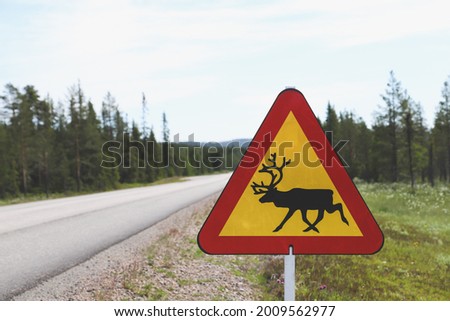 Beware of rain deer, road sign in north Sweden 