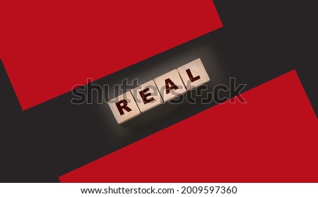RENT word on wooden cubes on a pink lilac and beige. Real estate business concept.
