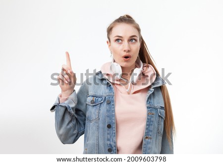 I have an idea. Young caucasian woman showing thumb up on white background