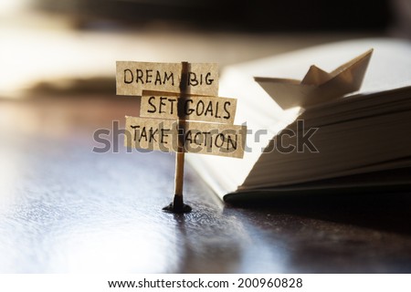 Dream Big, Set Goals, Take Action, concept, tags on the table. Royalty-Free Stock Photo #200960828