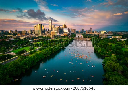 colorful skyline at golden hour blue and pink clouds over Austin Texas USA Aerial Drone view above cityscape during gorgeous sunset 