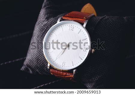 Stylish watch on a black background. Men's Leather Watch for Showcase