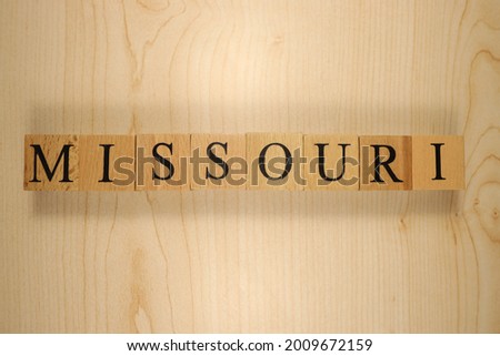 The word Missouri was created from wooden letter cubes. Cities and words. close up.