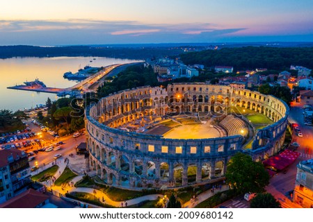 Sunset aerial view of Roman amphitheatre in Pula, Croatia Royalty-Free Stock Photo #2009680142