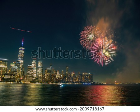 Fireworks celebration of July 4th with the famous Manhattan skyline at New York